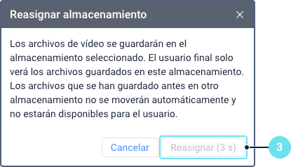 El cuadro de diálogo de confirmación \'Reasignar almacenamiento\'.
Muestra una advertencia de que los archivos existentes no se moverán
automáticamente. La llamada 3 señala el botón \'Reasignar\', que está
temporalmente deshabilitado y muestra un temporizador de cuenta
regresiva.